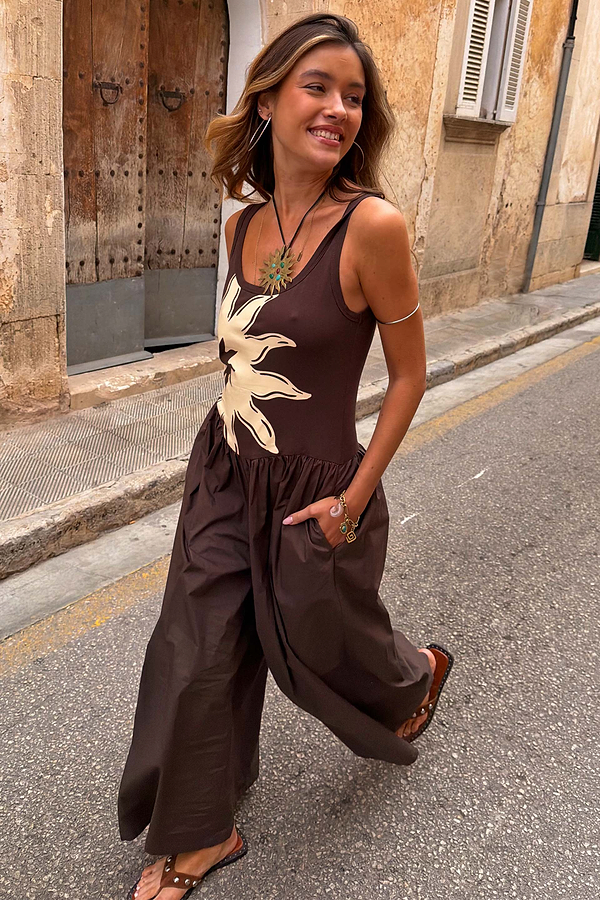 Chocolate Sun Poplin Jumpsuit with a soleil print bodice and wide-leg cotton trousers, styled on a city street.