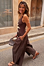 Thumbnail for Chocolate Sun Poplin Jumpsuit with a sun motif bodice and brown wide leg cotton trousers, styled for a vacation look.