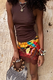 Chocolate Ribbed Tank in stretch fabric, styled with a colourful printed lace mini skirt and beaded bag.
