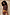 Thumbnail for Chocolate Ribbed Tank styled with a vibrant printed mini skirt and lace trim against a stone wall.