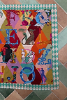 Circus Bandana featuring a multicoloured alphabet motif print and a teal checkered border for multi-wear styling.