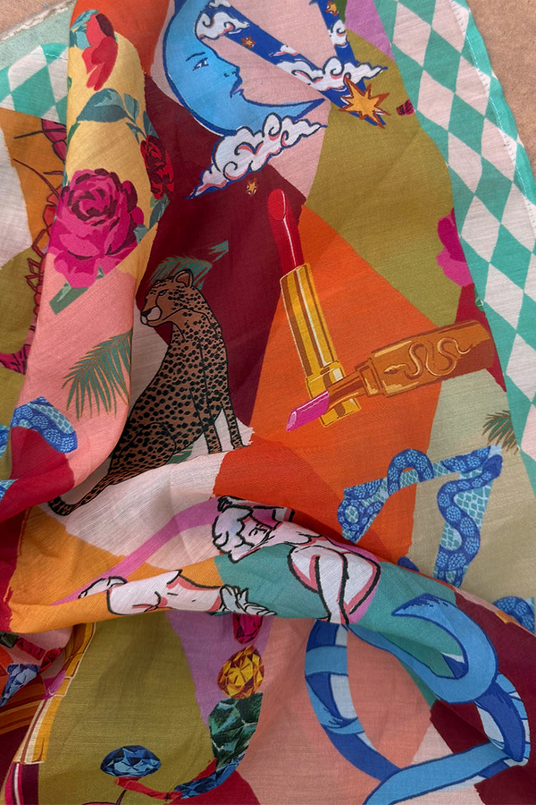 Circus Bandana featuring a vibrant multicoloured alphabet print with leopard motifs and a teal chequered border.