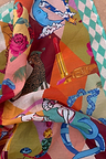 Circus Bandana featuring a vibrant multicoloured alphabet print with leopard motifs and a teal chequered border.