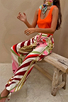 Cirque Cargo Naomi Trouser with a bold abstract print, balloon legs and adjustable ties, styled on a model.