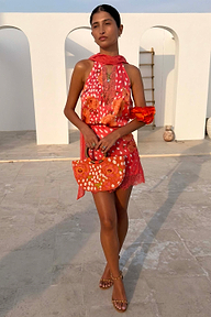 Coral Fawn Beaded Bag with glass bead embroidery and wooden handle, styled with a matching poppy print dress.