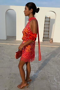 Coral Fawn Poppy Mini Maeva Skirt with a lace border, styled with a matching top and scarf in a side profile view.
