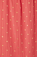 Coral Tilly Dress detail highlighting the textured plisse fabric and shimmering gold flecks.