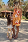 Girl's Yellow Sun Cotton Set featuring flared trousers and iconic soleil motifs on vacation.