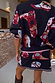 Thumbnail for Navy Cowboy Boots Cardigan with colourful boot motifs and pink trims, paired with a matching knit skirt.