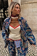 Cowgirl Ro Knitted Tank in cream and tan with red trim, layered with a blue paisley denim jacket and matching trousers.