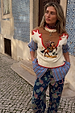 Cream Cowgirl Ro Knitted Tank featuring an embroidered cowgirl motif, red contrast stitching and padded shoulders.