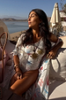 Cream Palma One Shoulder Swimsuit with hand-painted sun motifs and crochet trim, styled with a matching robe.