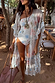 Cream Palma Kimono featuring hand-painted Sol De Palma motifs and a frill hem for holiday styling.