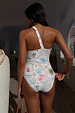 Cream Palma One Shoulder Swimsuit with hand-painted palm motifs and poem print, shown from the back.
