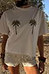 Thumbnail for Cream Shells Hot Pants with shell and glass beading, styled with a palm tree tee for a vacation look.