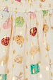 Cream Shell Elissa Shorts featuring a colourful shell print, gold flecks and an elasticated waistband.