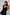 Thumbnail for Black crochet Alicia dress with silver sequin details and tie straps, styled with sunglasses for a vacation.