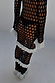 Mono Crochet Chloe Dress in black wide-knit fishnet with contrasting white frills and ruffled cuffs.