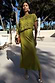 Thumbnail for Green Shell Crochet Tilly Dress with a shell-embellished crochet top and satin skirt, styled for a sunny vacation.