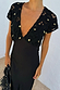 Black Crochet Shell Elodie Dress with gold shell charms on the crochet bodice and a black satin skirt.