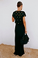 Black Crochet Shell Elodie Dress with gold shell embellishments and a satin skirt, styled with a fringed bag.