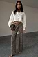 Thumbnail for White Cropped Cotton Miley Shirt with tortoise buttons and blouson sleeves, styled with leopard print trousers.