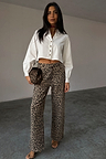 White Cropped Cotton Miley Shirt with tortoise buttons and blouson sleeves, styled with leopard print trousers.
