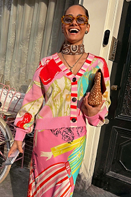 Pink Dallas Cardigan and Dorris skirt with cowboy motifs and striped details, styled in a London street setting.