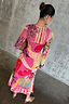 Pink Dallas Mesh Midaxi Dress with abstract cowboy motifs and long sleeves in a sheer, stretchy fabric.