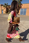 Pink Dallas Dorris Skirt featuring an in-house abstract cowboy print, styled with a leopard clutch and brown suede boots.