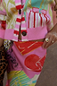 Pink Dallas Dorris Skirt featuring abstract cowgirl motifs and a matching pink striped knit cardigan.