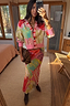 Pink Dallas Dorris Skirt in an abstract cowboy print, styled with a matching cardigan and leopard clutch.