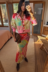 Pink Dallas Dorris Skirt in an abstract cowboy print, styled with a matching cardigan and leopard clutch.