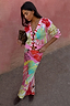 Thumbnail for Pink Dallas Dorris Skirt featuring an abstract cowboy print, styled with a matching cardigan and leopard clutch.