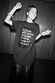 Thumbnail for Black Dance Sequin Cara T Shirt Dress with a lace skirt insert and a sequinned slogan on a smiling model.