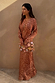 Iconic Fawn Soho Dress in a blush and cream deer print with long flared sleeves and a satin-esque finish.