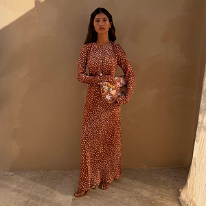 Fawn Soho Dress in a brown and cream spotted fawn print with long flared sleeves and a maxi silhouette.