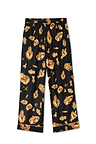 Deloris pyjama bottoms in black featuring gold hand, heart and eye motifs with an elasticated waist.