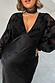 Black Swallow Romance Emma Dress in black with sheer devore velvet sleeves and a satin skirt on a pregnant model.