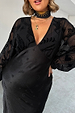 Black Swallow Romance Emma Dress in black with sheer devore velvet sleeves and a satin skirt on a pregnant model.