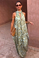 Green Diamond Print Halter Top in olive satin with a draped scarf and asymmetric hem, styled with matching trousers.