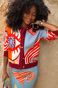 Dolce Vita Hollie Cardigan featuring an eye graphic, colour-block knit and burgundy ribbed trims.