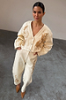 Ecru Raffia Palma Barrel Leg Jeans with brown floral embroidery and a matching cropped jacket.