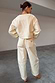 Thumbnail for Ecru Raffia Palma Barrel Leg Jeans with scallop back pocket detailing and tonal NFD logo embroidery.
