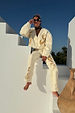 Ecru Raffia Palma Barrel Leg Jeans with textured palm embroidery, styled as a co-ord on white outdoor stairs.