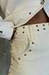 Thumbnail for Ecru Studded Hot Pants in cream denim featuring silver stud detailing on the waistband and front pocket.