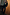 Thumbnail for Emerald Velvet Trousers and matching blazer with diamond studs on a model leaning against a wooden wall.
