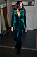 Emerald Velvet Trousers with diamond studs and matching blazer, styled for a party look.