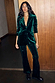 Emerald velvet trousers and matching blazer with diamond studs, styled as a festive party co-ord.