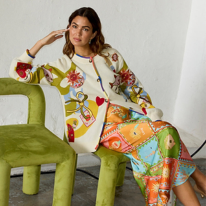 Multi Enchanted Cardigan in cream knit featuring sun and heart motifs with a multi-coloured ribbed trim.